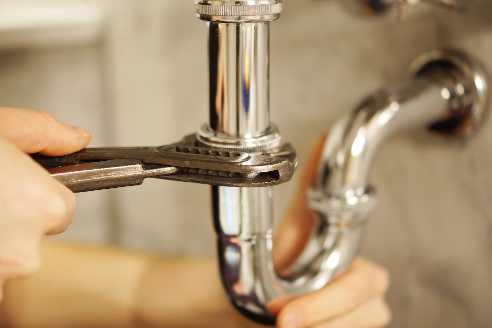 Leak detection plumber inspecting pipe in Werribee home